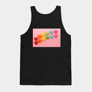 Heart-shaped Candy arranged in rainbow order on a pink background Tank Top